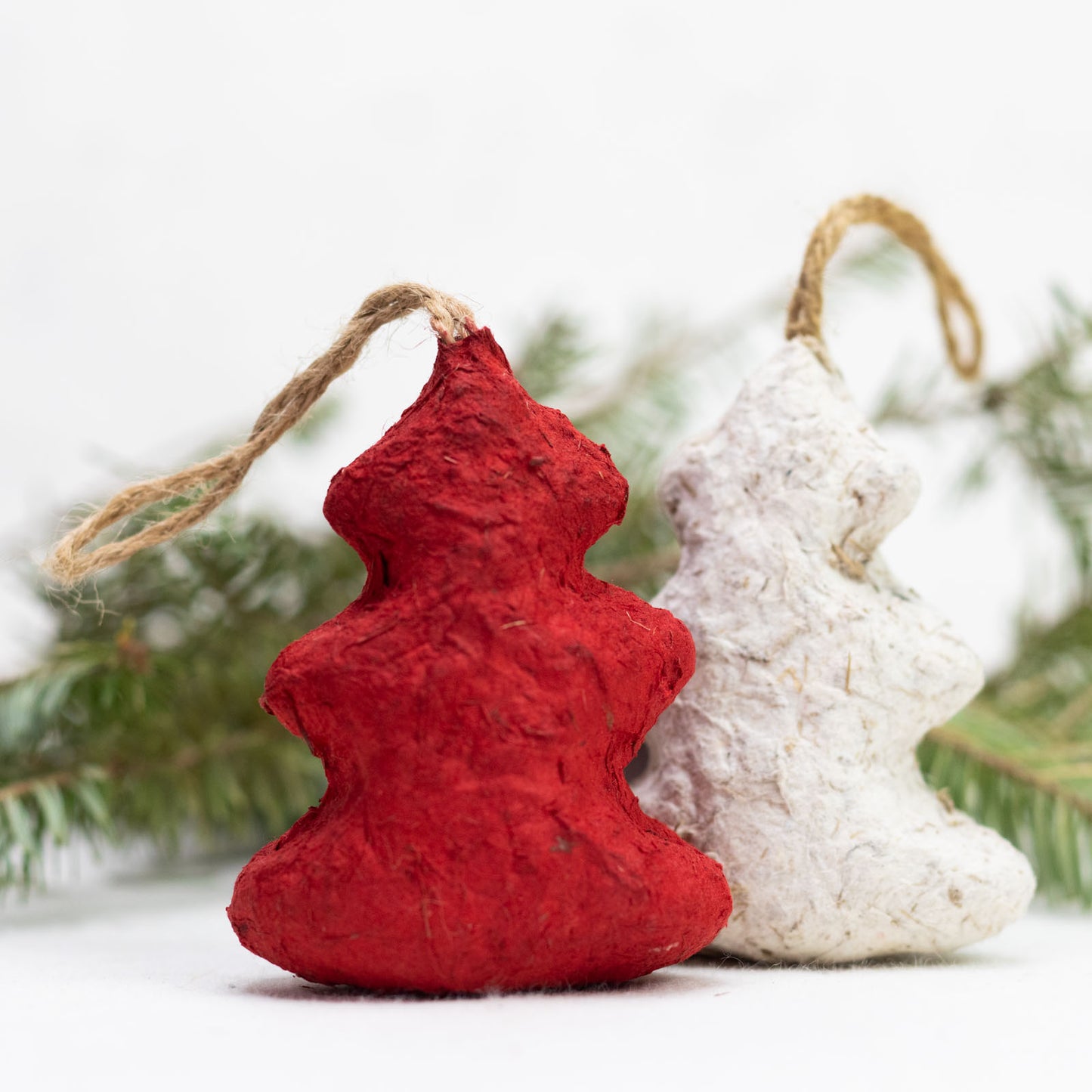 eco-friendly ornaments shaped like christmas trees in red and white