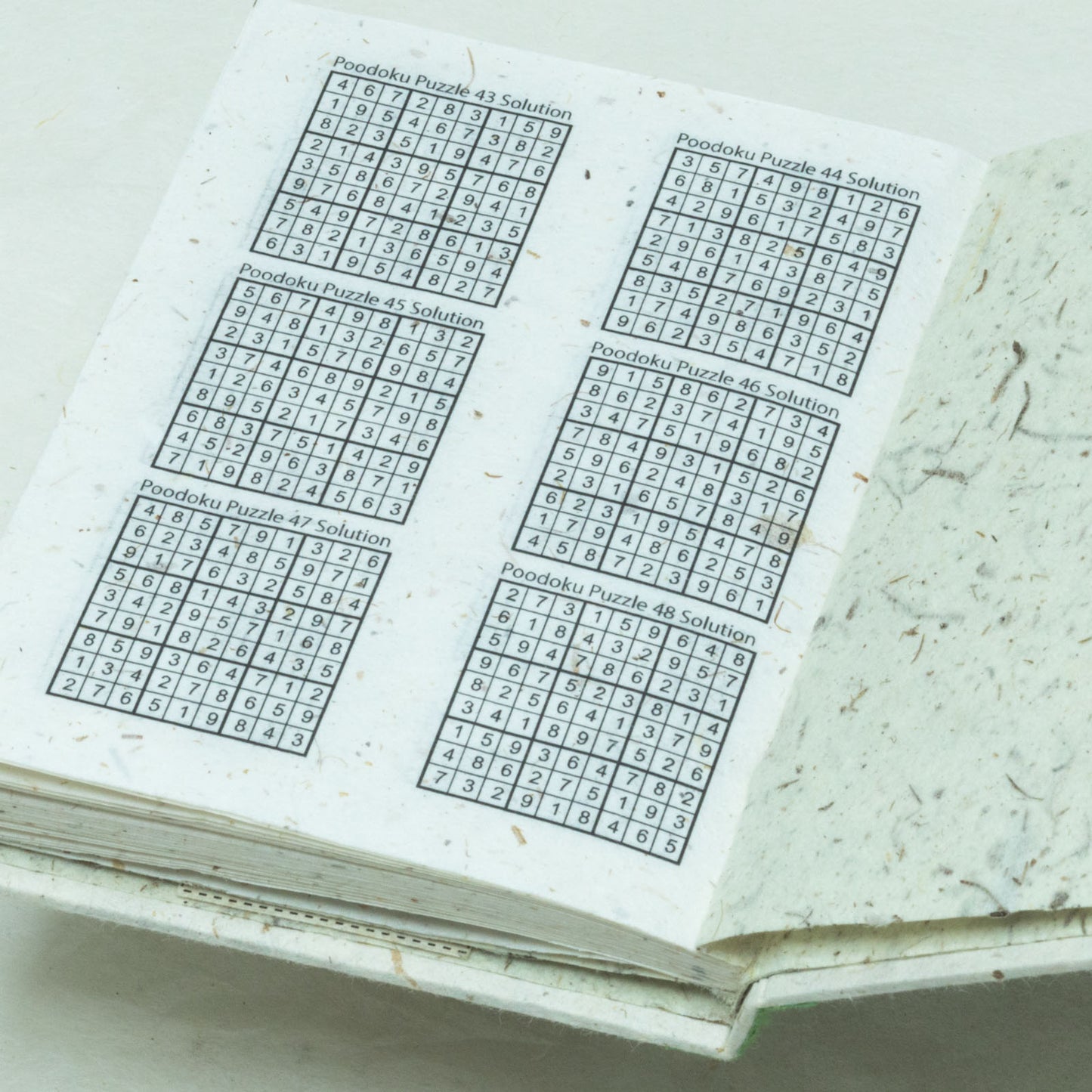 Poodoku - Three Volume Sudoku Number Placement Puzzle Set - Inside answer sheet of sustainable puzzles book